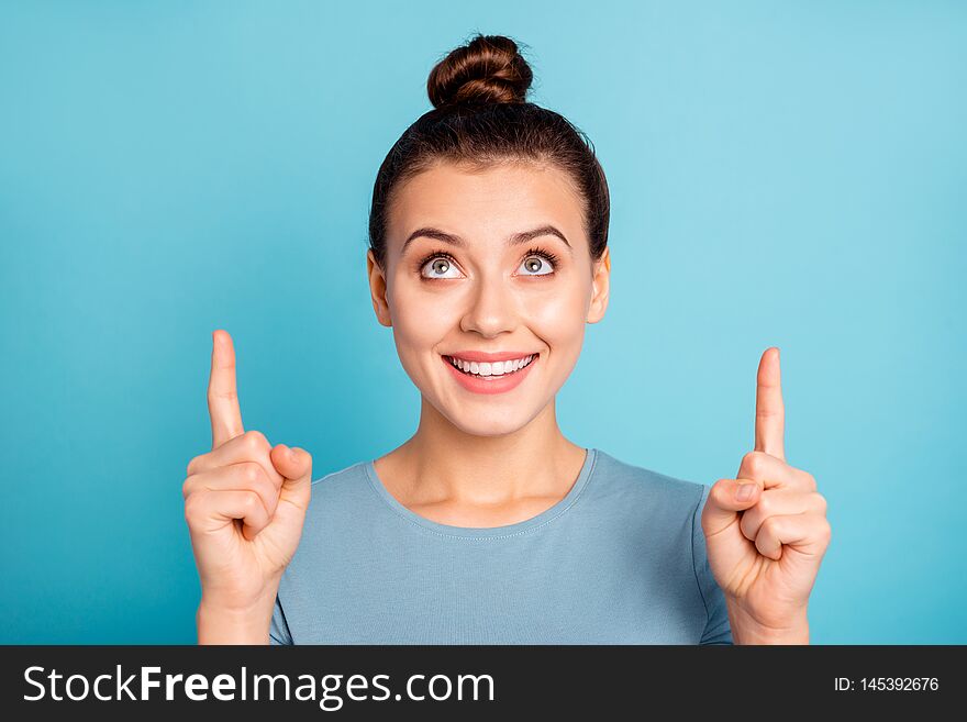 Close up photo beautiful she her lady hold arms hands fingers indicate look up empty space proposition advising buy buyer low prices wear casual sweater pullover isolated blue bright background.