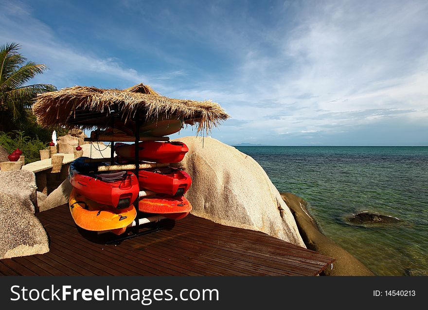 Canoes or Kayak on a deck by the coral reef in Koh Tao, Thailand.