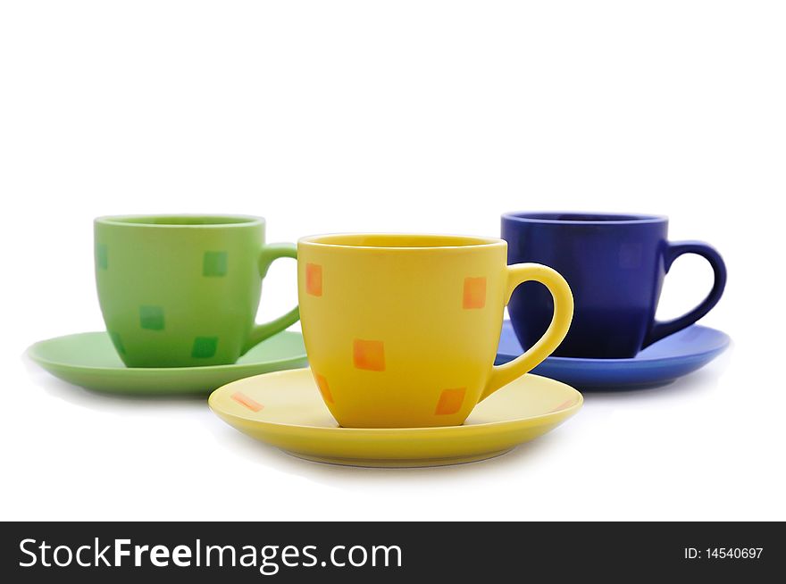 Isolated bright cups of different colours