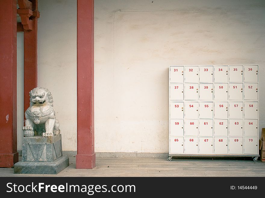 Lion statue next to boxes, Xiamen, China