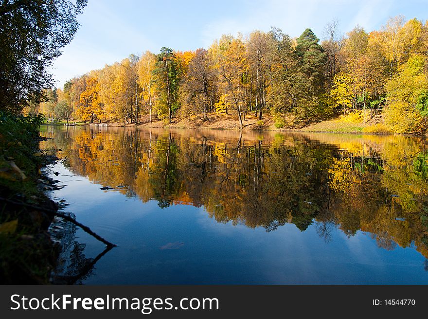 Idyllic  park area near blue lake in spring