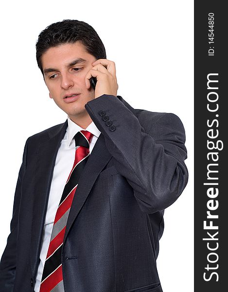 A young businesman speaking on the phone on a white background. A young businesman speaking on the phone on a white background.