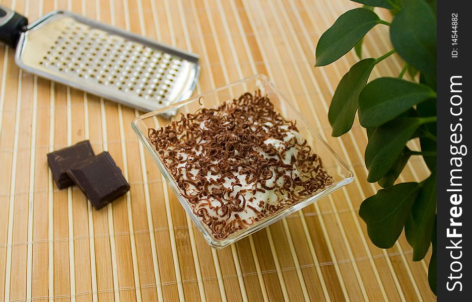 Yogurt  with chocolate drops on the bamboo.