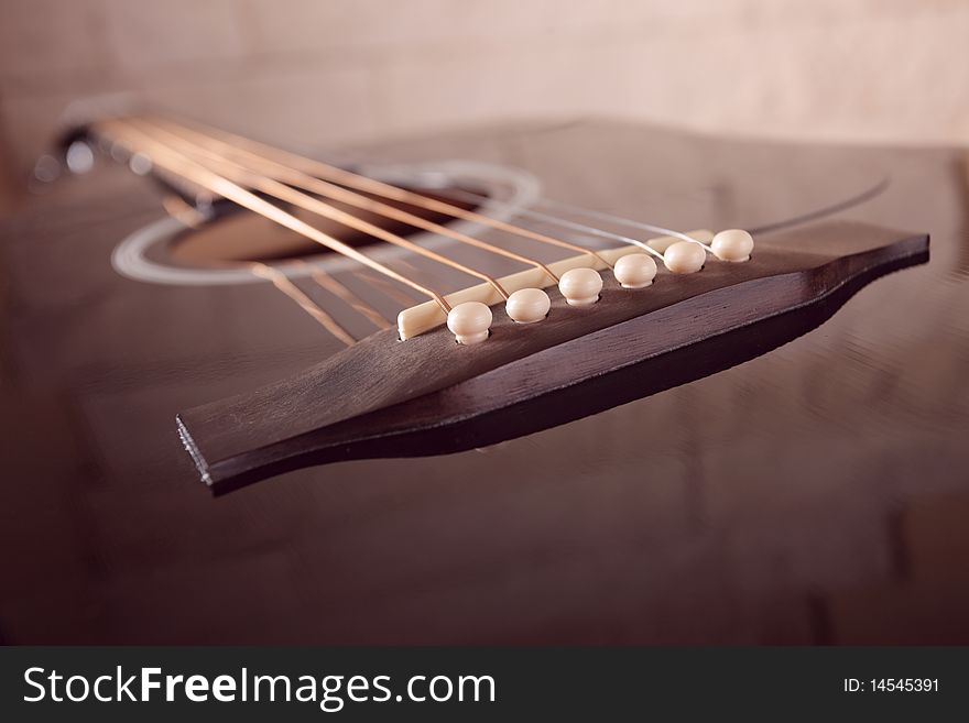 Black guitar,focus on a foreground