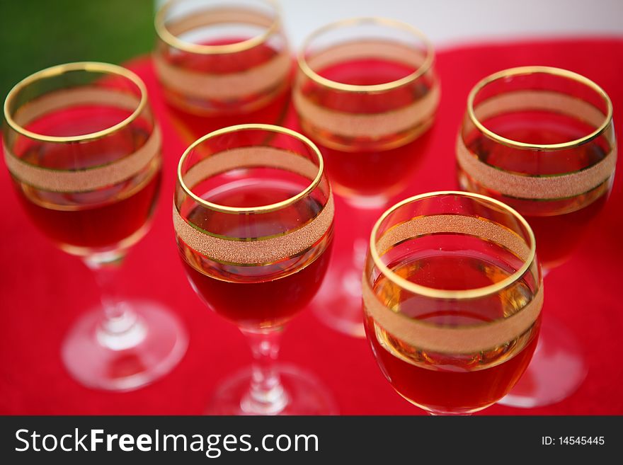 Wine glasses on a red table.