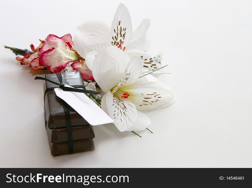 Chocs and flowers concept of a gift background