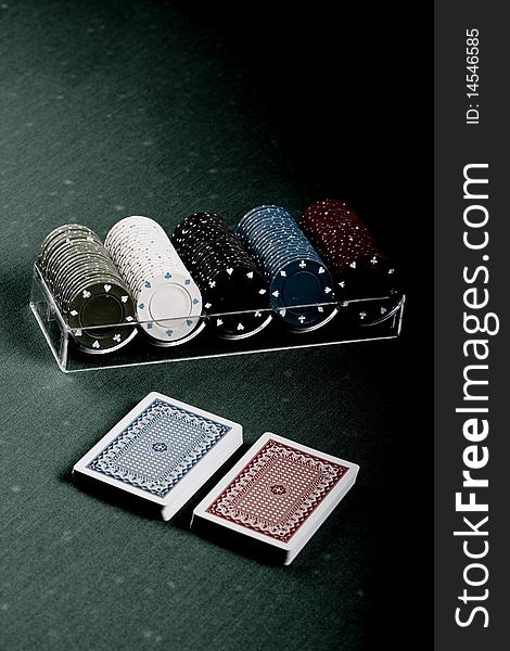 Casino gambling chips on green table. Casino gambling chips on green table