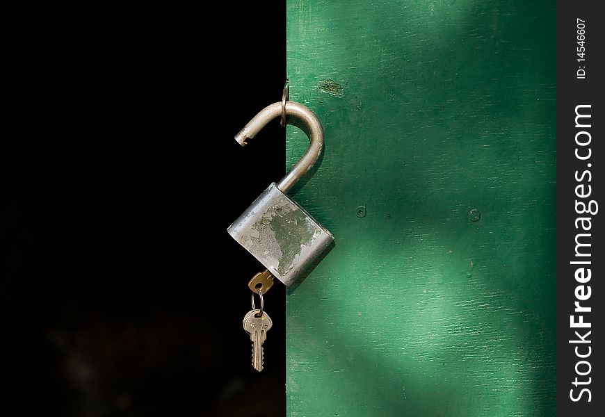 Open a padlock with keys to the green door
