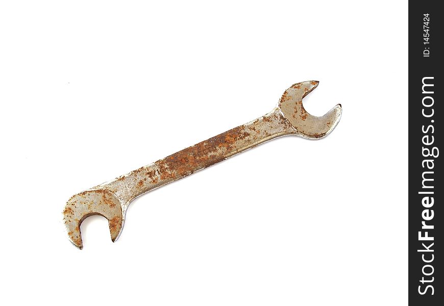 Rusty spanner  on a plane white background.