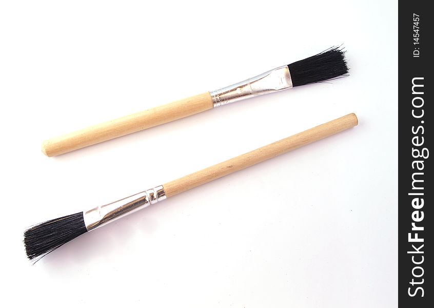 Two new paint brushes on a white background.