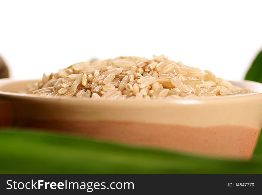 Brown rice in isolated white