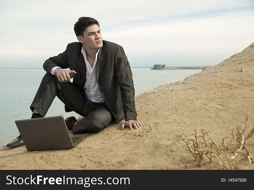 Businessman at the beach