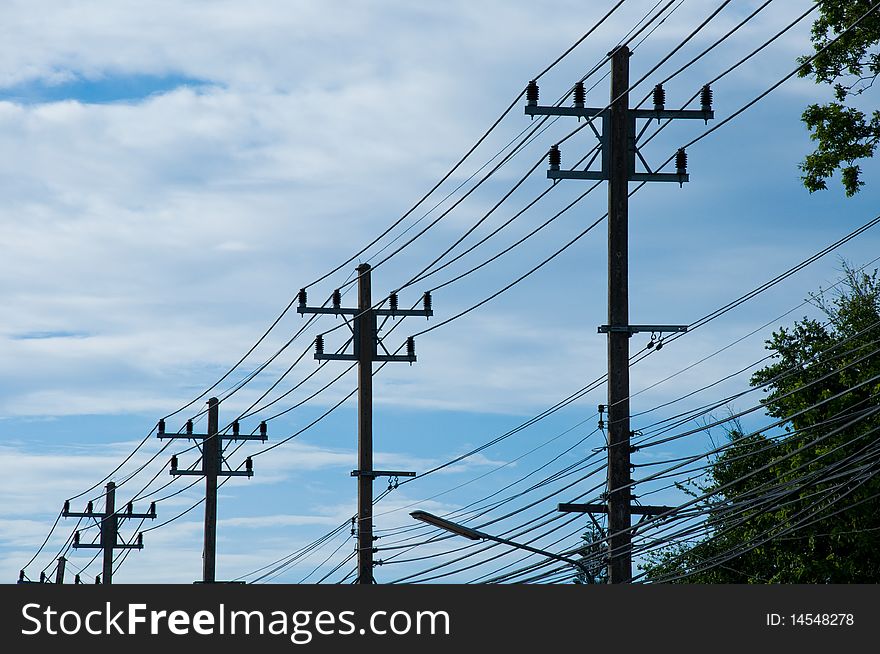 Electric tower on a blue sky background.