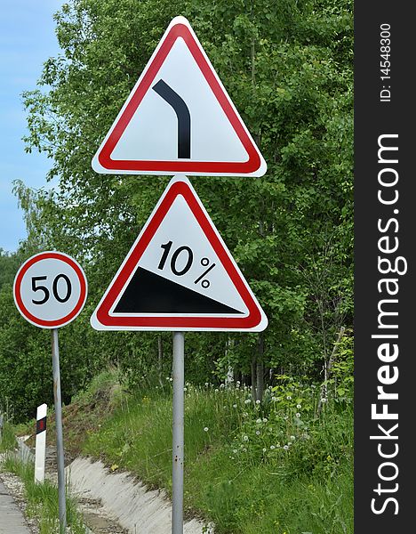 Signs on a rural road, speed limit, slope. Signs on a rural road, speed limit, slope