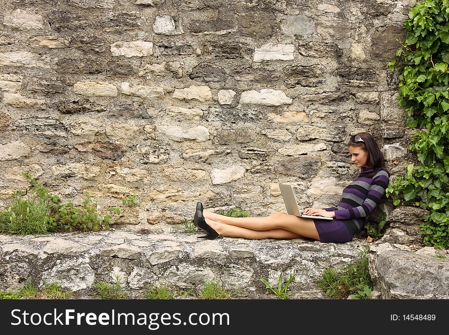 Brunette Woman With Laptop Outdoor