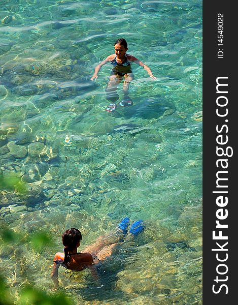 Two girls are having fun in adriatic water