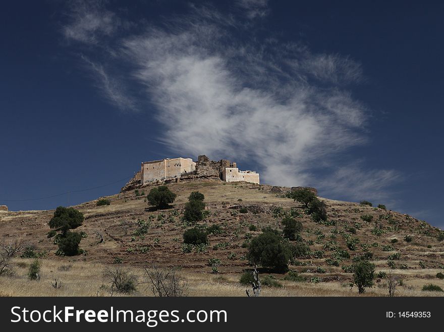 Old hystorical fort in mountain of Marocco with blue sky