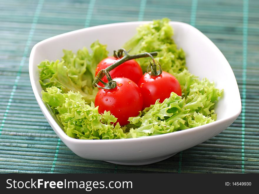 Fresh healthy tomatoes with lettuce hi-res
