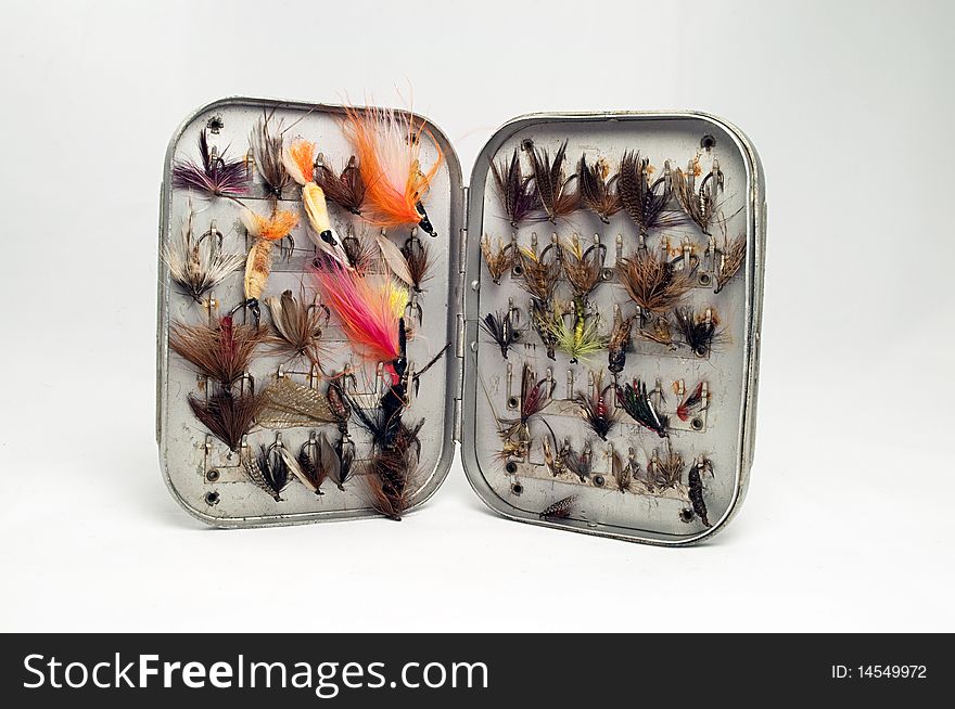 Selection of dry fishing fly in old metal box. Selection of dry fishing fly in old metal box