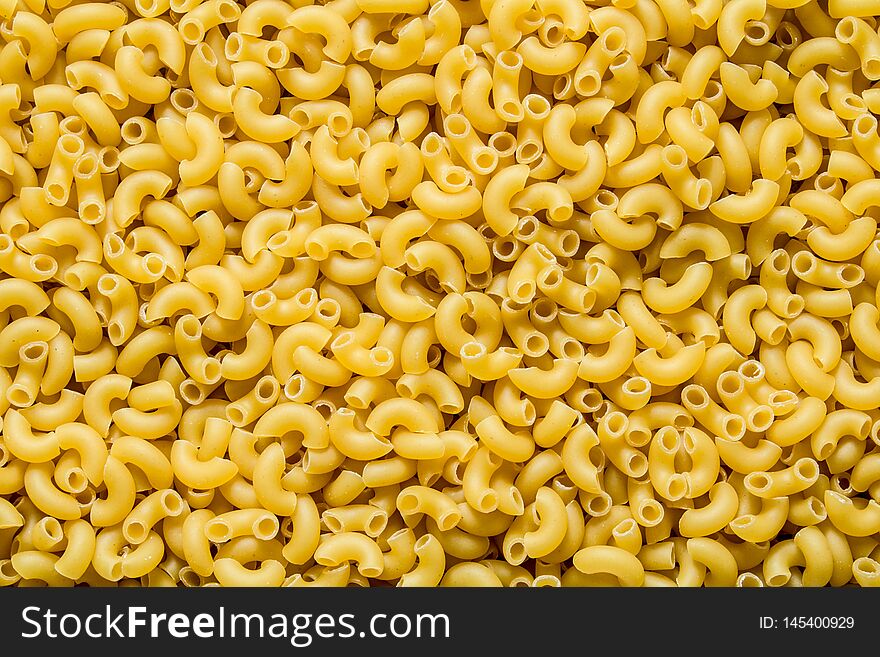 Pasta background. Dry pasta. Top view. The texture of the pasta