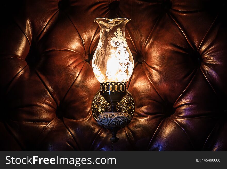 Antique lamp on the wall of leather