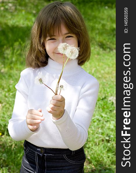 Girl and dandelions