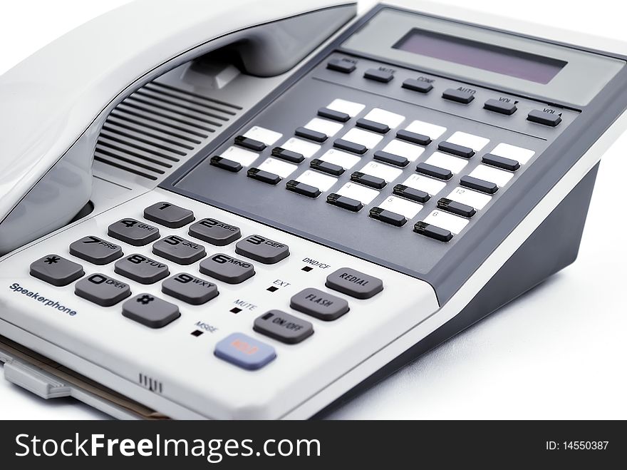 Multifunctional office phone closeup on white background