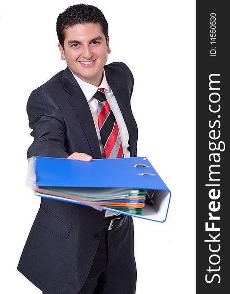 A young businessman giving a binder full of files. A young businessman giving a binder full of files.