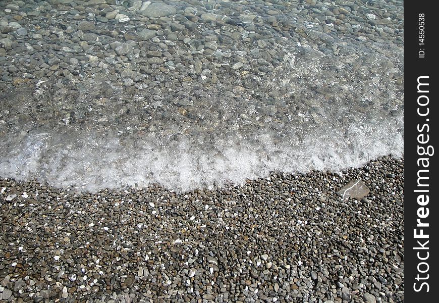 Pebble on the beach in Calabria.
Crystal clear water and gentle foot massage by walking on the fresh gravel. Pebble on the beach in Calabria.
Crystal clear water and gentle foot massage by walking on the fresh gravel.