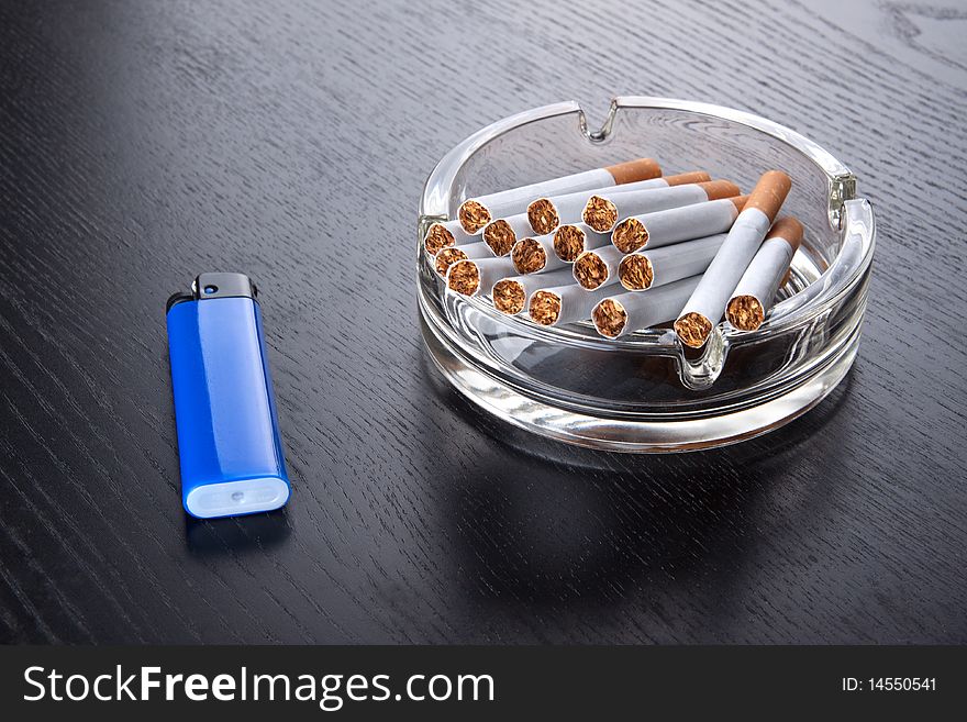 Ashtray and lighter on a table