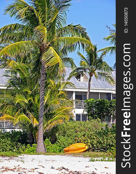 Small yellow boat on beach Sanibel Island Florida