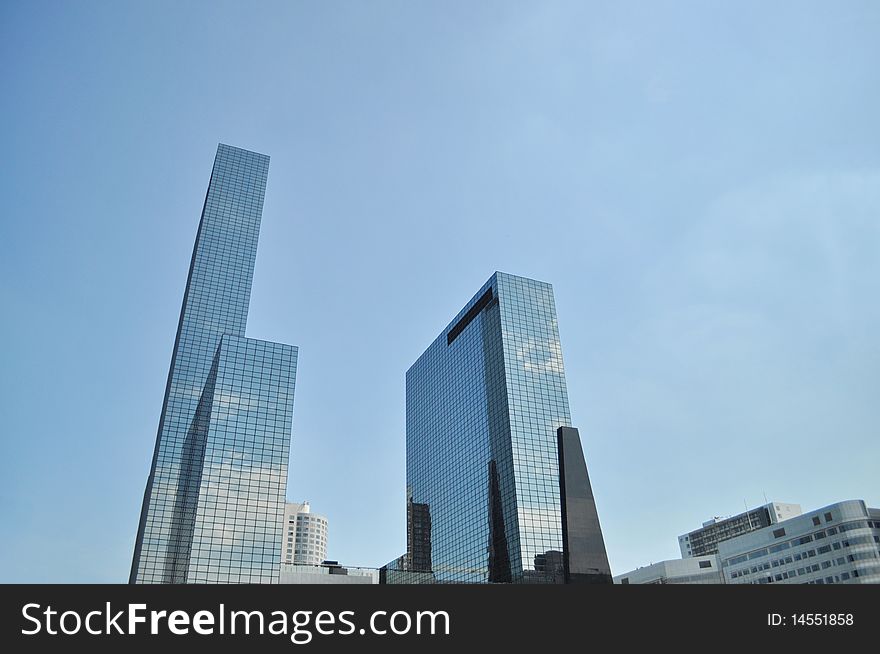 Skyscrapers complex reflects cloud and sky