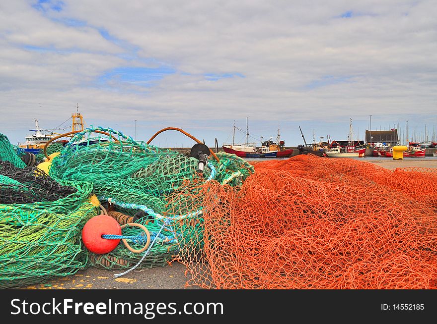 Fishing nets lying on ground in fishing harbour in dublin ireland