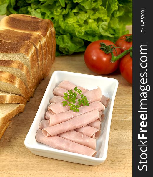 Sliced sandwich ham on a kitchen bench