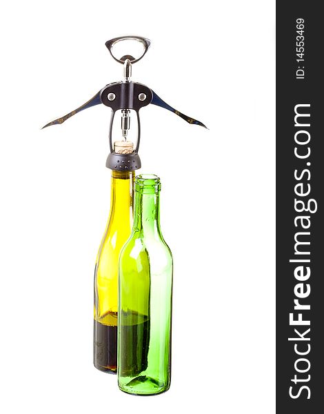 Corkscrew and green wine bottles. Corkscrew and green wine bottles