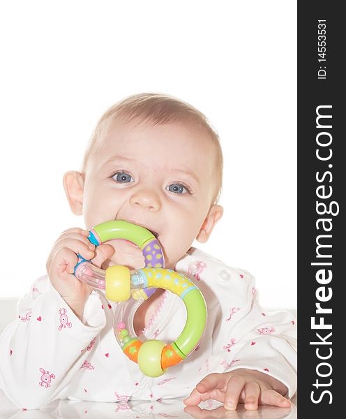 Portrait of the newborn child with a toy in a hand. Portrait of the newborn child with a toy in a hand