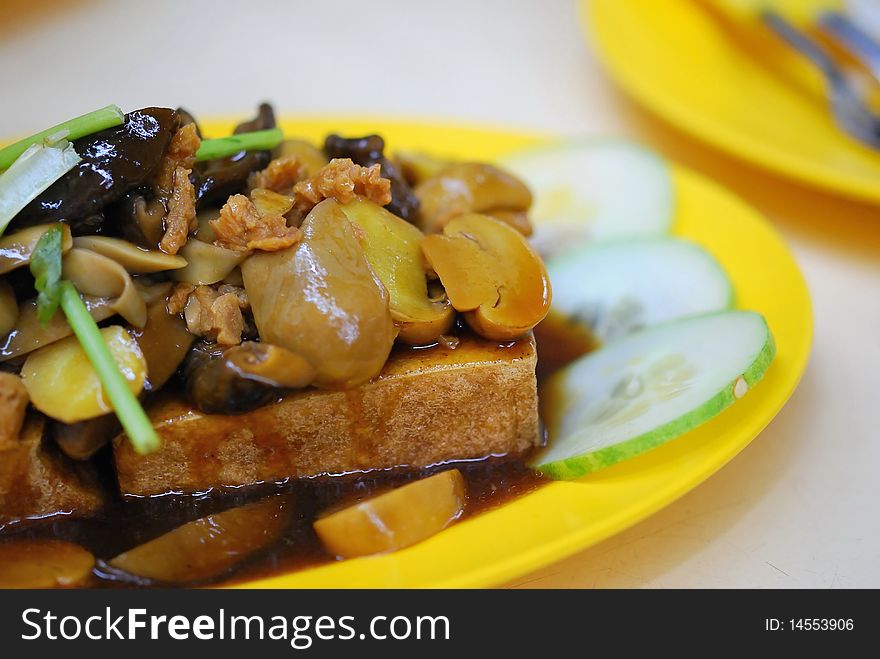 Home cooked Chinese vegetarian bean curd cuisine topped with healthy mushrooms. Suitable for food and beverage, healthy eating and lifestyle, and diet and nutrition. Home cooked Chinese vegetarian bean curd cuisine topped with healthy mushrooms. Suitable for food and beverage, healthy eating and lifestyle, and diet and nutrition.