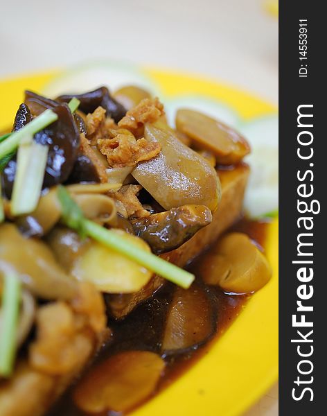 Home cooked Chinese vegetarian bean curd cuisine topped with healthy mushrooms. Suitable for food and beverage, healthy eating and lifestyle, and diet and nutrition. Home cooked Chinese vegetarian bean curd cuisine topped with healthy mushrooms. Suitable for food and beverage, healthy eating and lifestyle, and diet and nutrition.