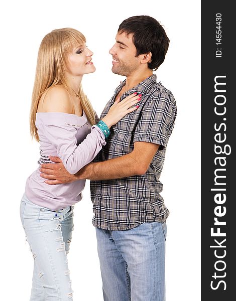 Romantic young couple in casual clothing, white background. Romantic young couple in casual clothing, white background