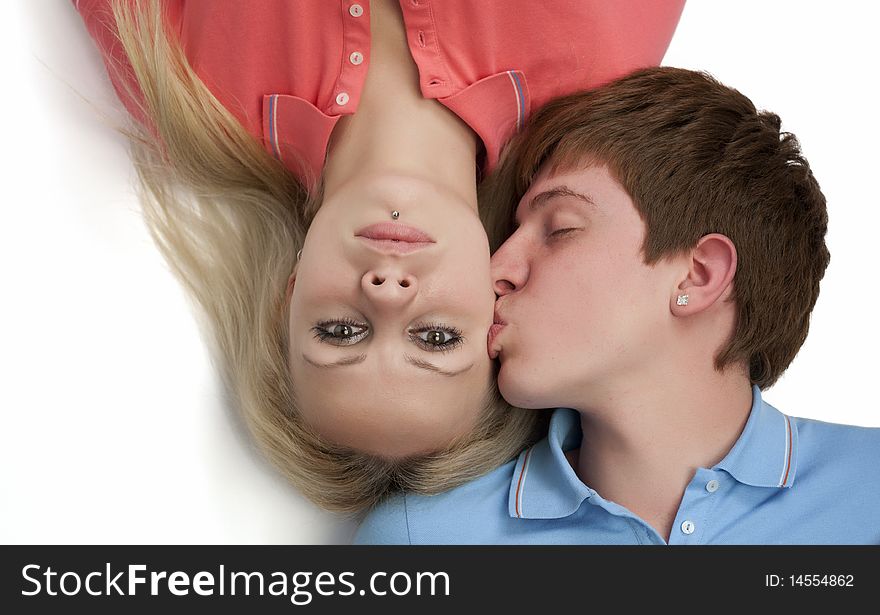 Portrait of a boy kissing his girlfriend. Portrait of a boy kissing his girlfriend
