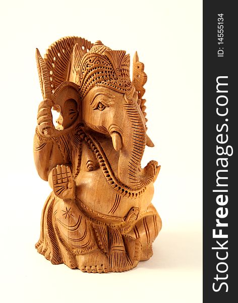 Wooden figurine of the Indian deity. Wooden figurine of the Indian deity