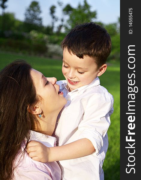 Mother playing with her son outdoor