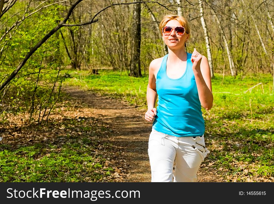 Young woman running in the park. Young woman running in the park