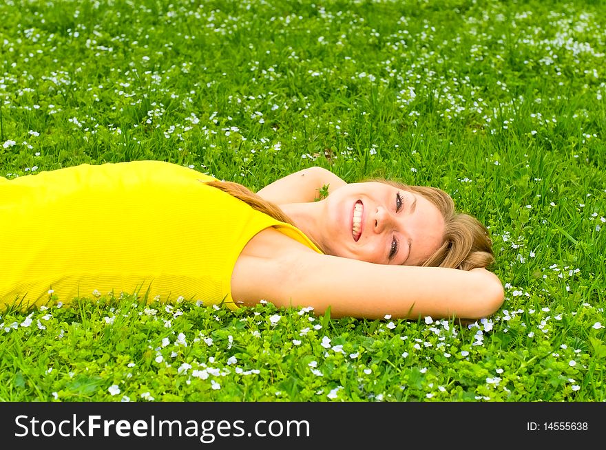 Portrait of young smiling woman on meadow. Portrait of young smiling woman on meadow