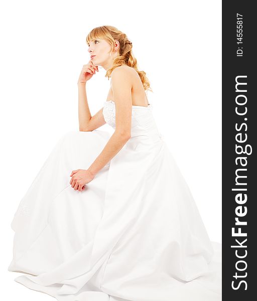 Thughtful bride sitting, isolated on white
