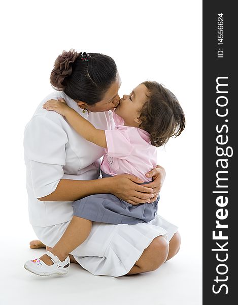 Daughter and mother kissing, isolated on white background