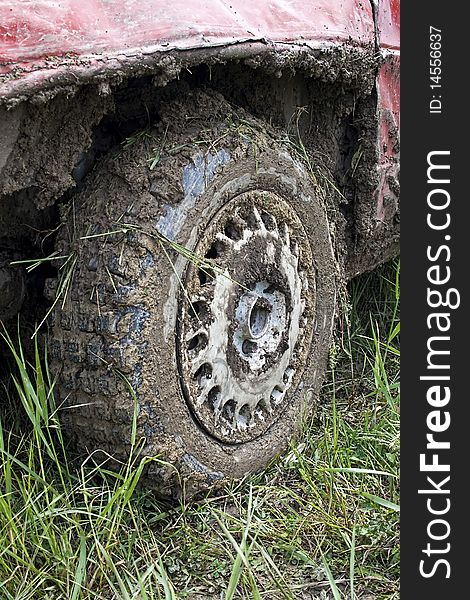 Muddy car tire from car race