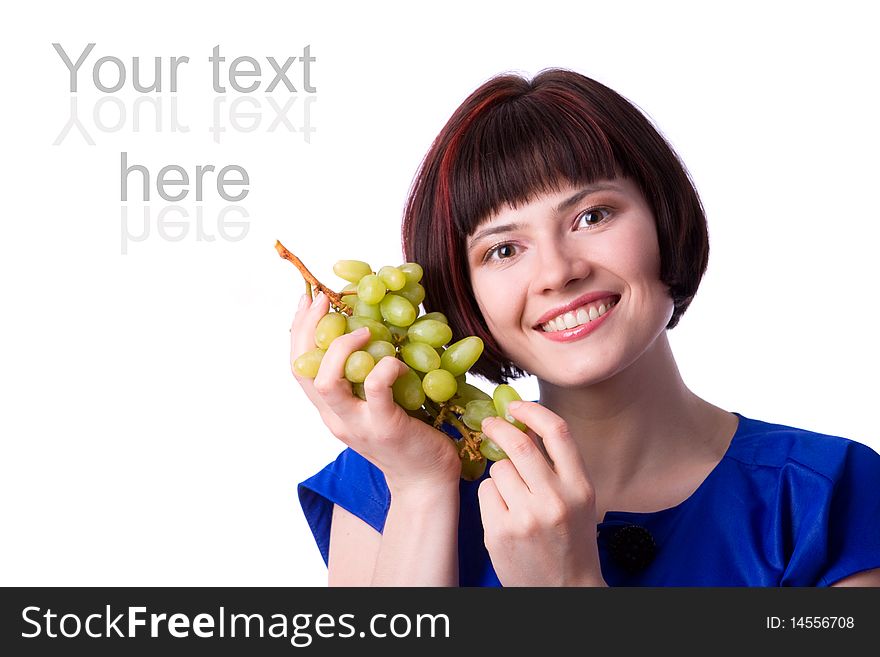 Woman holding a bunch of green grapes