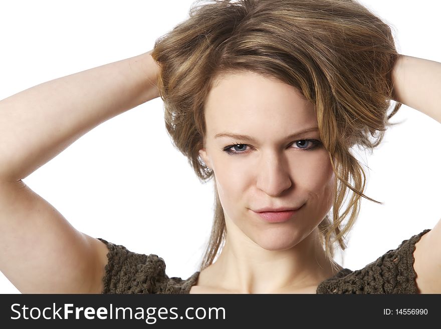Close-up of sensual young woman smiling with hands behind her head, isolated on white background. Close-up of sensual young woman smiling with hands behind her head, isolated on white background.