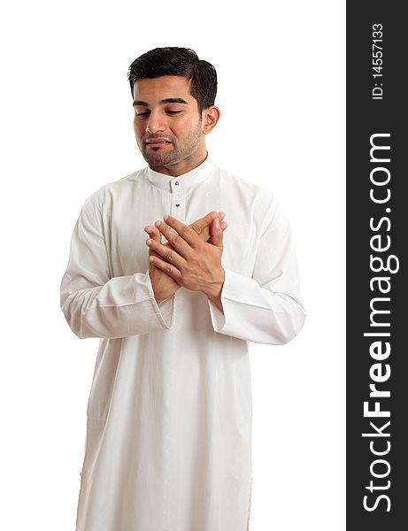A worried,troubled, stressed or sad ethnic middle eastern or arab man in traditional white robe. White background. A worried,troubled, stressed or sad ethnic middle eastern or arab man in traditional white robe. White background.